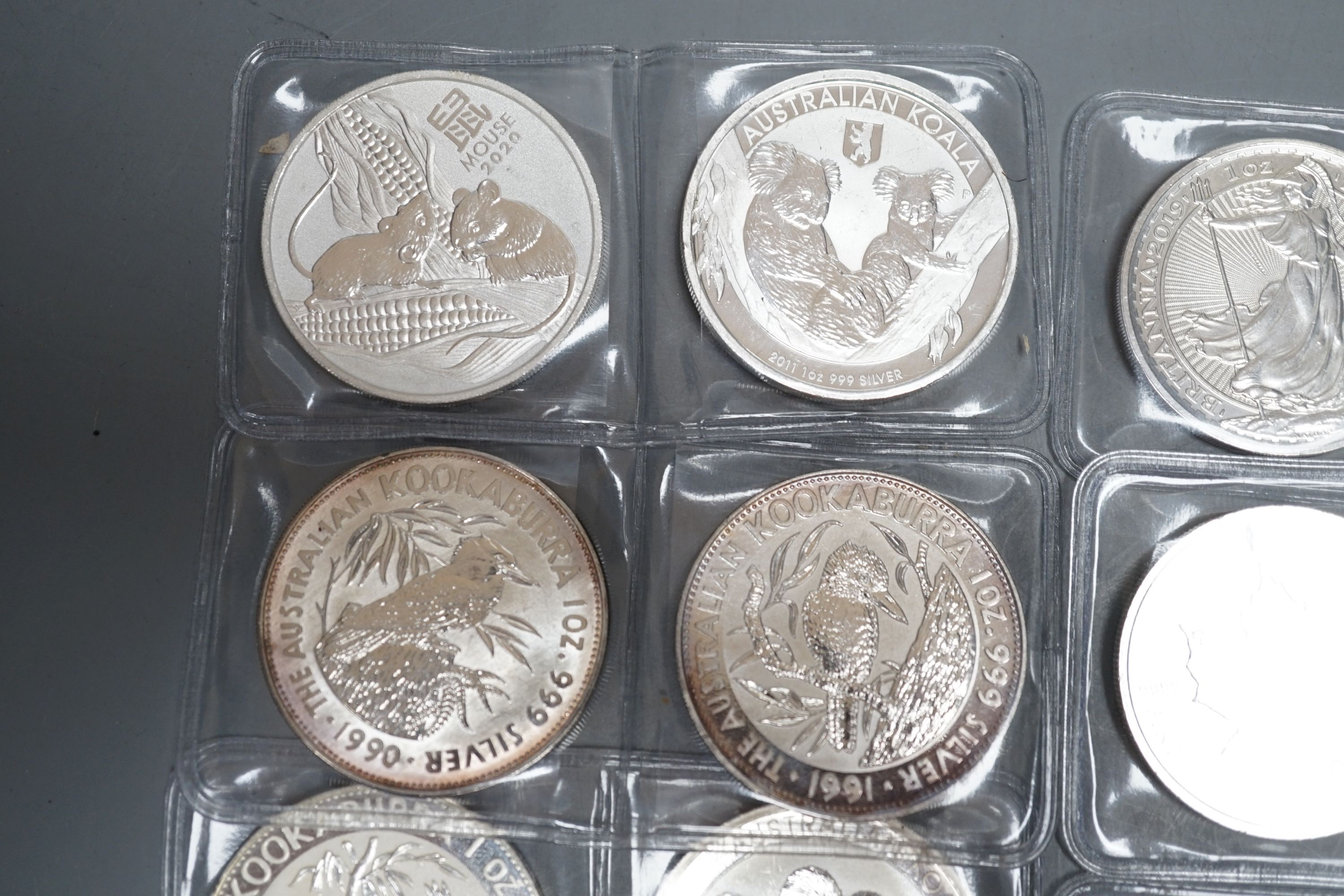 Eight 1oz assorted Australian 1 dollar coins, finesse .999, four 1oz assorted Canadian dollar coins, two silver 1oz coins- Britannia 2019 and George & Dragon, 2021 and two silver Australian triangular 1oz coins, 2019/202
